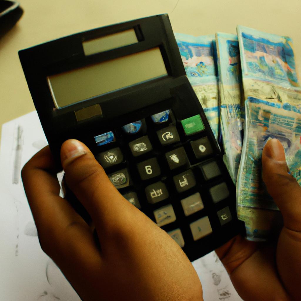 Person holding money and calculator